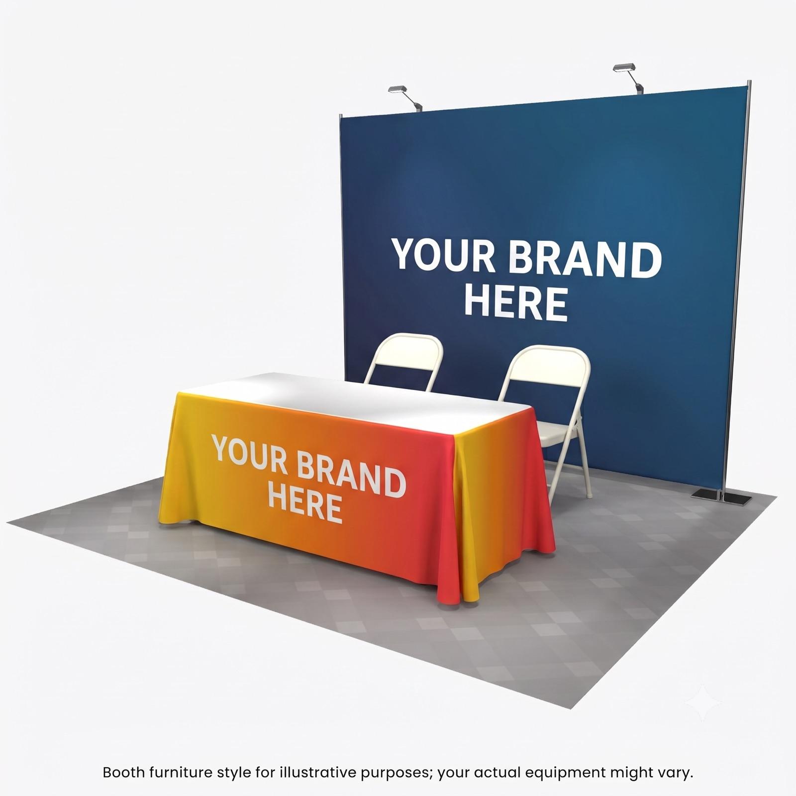 Gold sponsor booth setup with an 8x8 foot backdrop, branded tablecloth, and two chairs